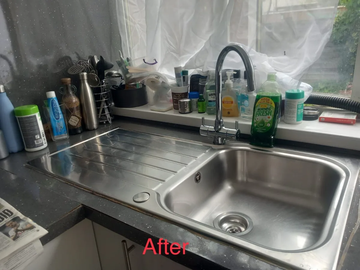 Kitchen sink and worktop left spotless after a clean